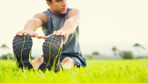 man stretching outside